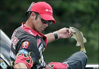 Iaconelli reaches for the ruler for a Pittsburgh specimen.