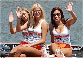<p>
	The lovely ladies of Hooters wave to the camera.</p>
