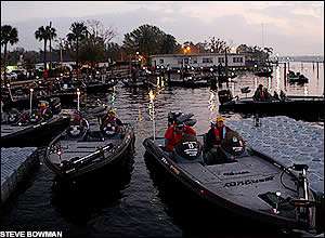 Competitors in the CITGO Bassmaster Classic sit and wait for the safe light Wednesday morning for the practice round on Lake Toho.