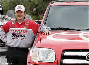 Greg Hackney poses with his new partner, a Toyota truck.