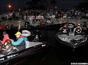 Boats pull away from the dock headed to take off in the opening round of the CITGO Bassmaster Classic.