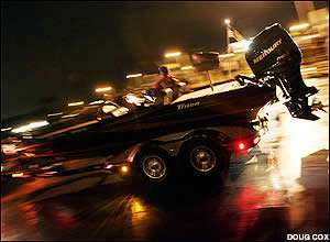 Competitors in the Bassmaster Classic launch their boats in the dark on Lake Toho.