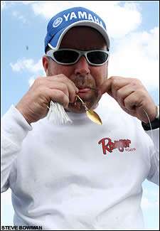 Chad Morgenthaler reties a spinnerbait after he checked in on the practice day at Lake Toho.