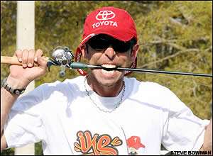 Mike Iaconelli clowns around as he organizes tackle after a practice on Lake Toho.