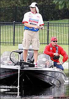 Randy Howell hopes to keep the sun off his head and the bass in his livewell.