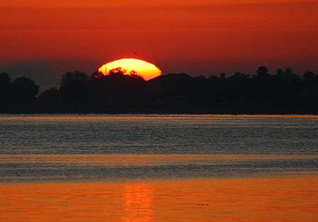 The rising sun over Florida's Lake Toho reveals that launch time is near.