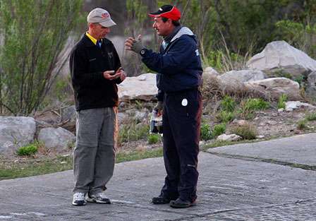 BASS Tournament Director Trip Weldon gives Shaw Grigsby the news of the Day One cancellation due to forecasted high winds.