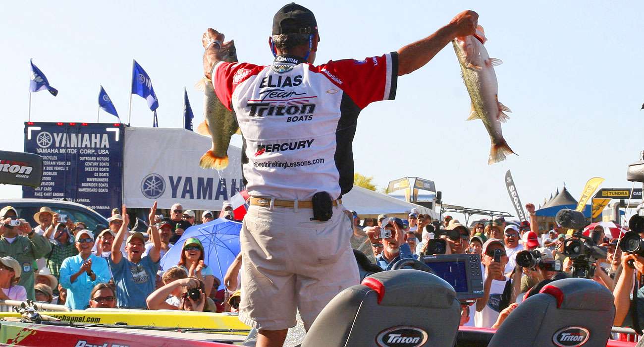 Elias shows off his winning bass to the crowd on Sunday. He took the lead from Terry Scroggins by 4 ounces and held on to eclipse Aaron Martens by 3 pounds.