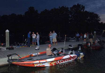 An angler makes last minute tackle adjustments prior to the start of competition.