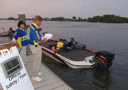 Officials check boats prior to releasing them for the day of fishing.