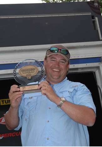 Ron Dubose of Opelike, AL holds the winner's trophy for the non boater division.  He brought in 18-9 for two days.