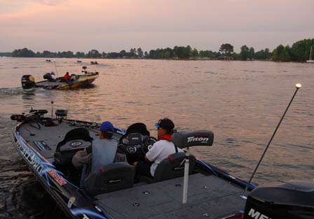Scott Smith and his partner head out in early morning light to begin their final day of fishing.