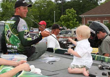 Aaron Martens helps his son Spencer as he learns how to reel in the big ones.