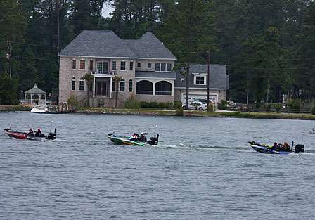 Boats idle out of one of the biggest no-wake zones on the tour as they head for the main lake.