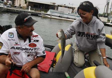 Pete Ponds and co-angler Mary Delgado load their fish Thursday.