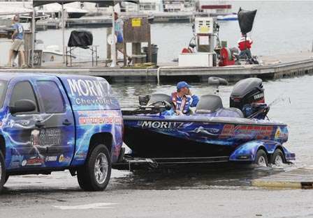 Brian Clark and his boat are pulled out of the water Thursday.
