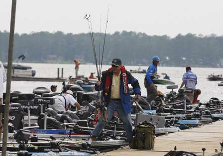 John Wentzell, a co-angler that finished in 78th place, gathers his rods.