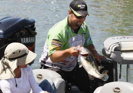 Current leader Fred Roumbanis pulls out a nice one. His co-angler is Mary Delgado.