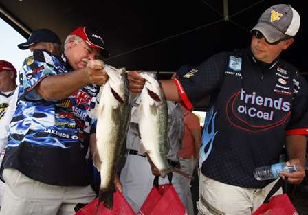 Tommy Biffle and Jeremy Starks compare fish at the weigh-in.