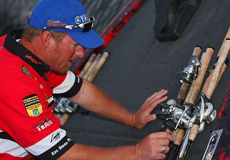 Kelly Jordon ties down his rods prior to launch.