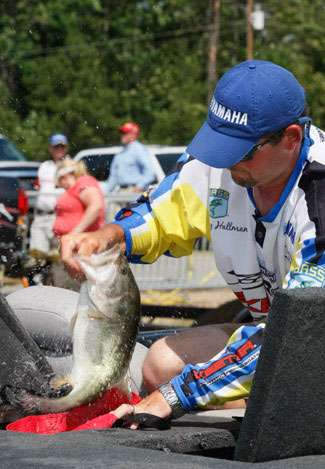 Bradley Hallman bags his fish for the weigh-in.