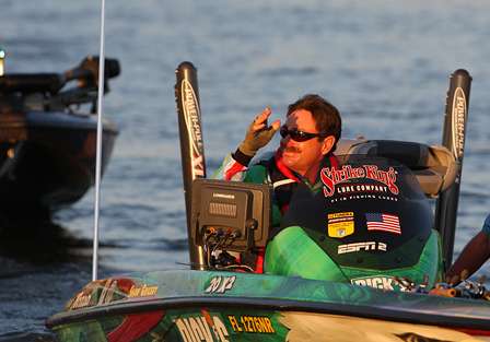 Shaw Grigsby waves to the crowd as he idles out of Ingalls Harbor to begin Day One of the Southern Challenge.
