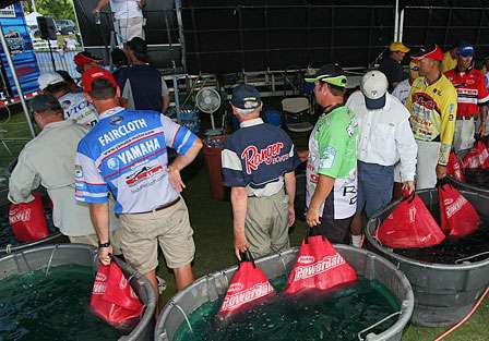A late flight of anglers waits for their turn on the weigh-in stage.