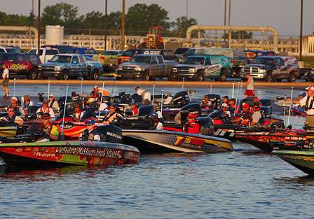Pros gang up as the line of boats idle through the inspection process.
