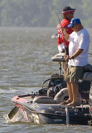  Co-angler Jimmy Sparks pulls a fish into the boat on Day Two.