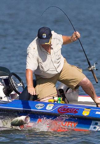 Co-angler Danny Grissett, fishing with Elite Series pro Grant Goldbeck, fights a good fish to the boat.