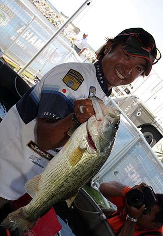 Morizo Shimizu holds up a healthy Wheeler Lake bass that would help him to a two-day total of 34 pounds, 11 ounces, good for sixth place going into Saturday.