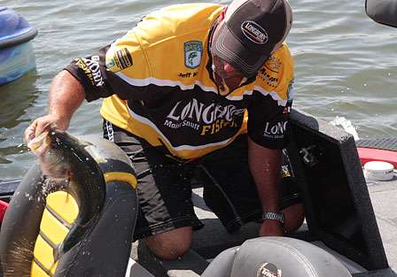 Jeff Kriet holds tight to a Wheeler Lake bass that helped him squeak into the fifty cut by two places. 