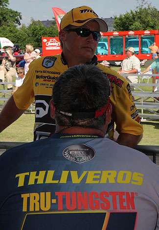 Peter Thliveros talks with Terry Scroggins out in front of the BASS trailer as the final flight weighs in.  Thliveros finished in 27th place on Day Two.