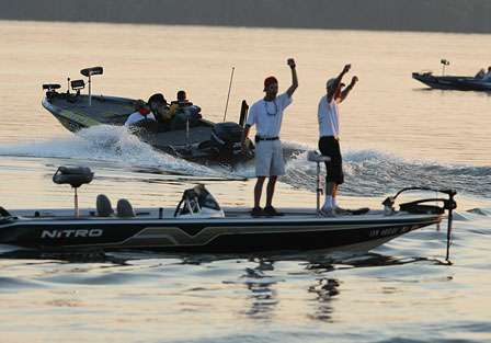 Scroggins takes his hole-shot while Alabama BASS fans (foreground) cheer on the pros as they leave the harbor.