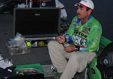 Shaw Grigsby puts the finishing touches on a spinnerbait as he makes final preparations early on Day Three.