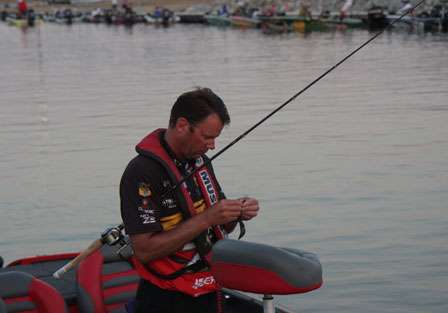 Kevin VanDam also makes final lure adjustments so that he will be ready when he reaches his first fishing spot of the day. He heads into Day Three in fourth place overall.