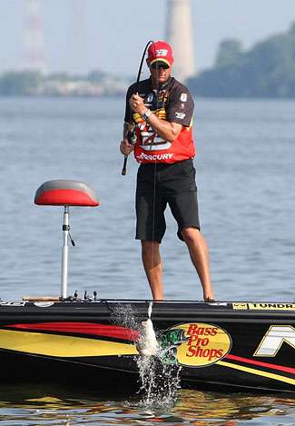 VanDam pulls the fish over the side of the boat. 