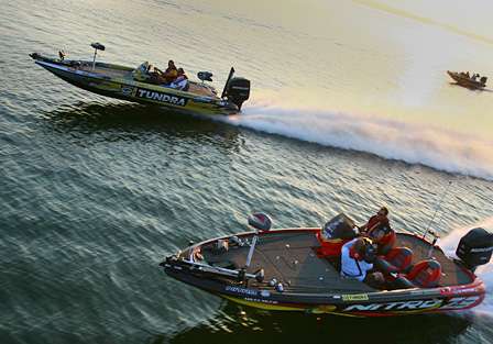 Kevin VanDam and Terry Scroggins speed to their first fishing spots.
