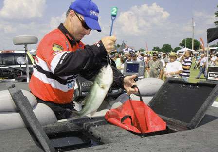 Mark Menendez bags one of his fish before his introduction to the crowd on the final day.
