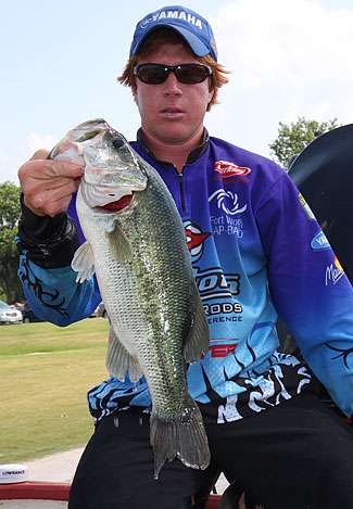 Corey Waldrop holds up a Wheeler Lake lunker that helped him to a ninth-place finish in his first-ever top 12 day of competition.