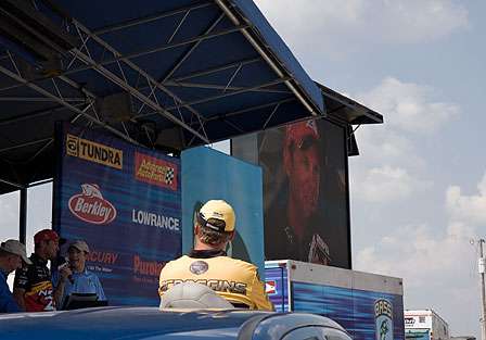 Terry Scroggins watched patiently as Kevin VanDam talks about his day on the water.