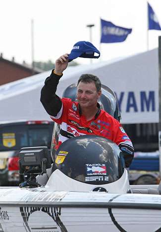 Mark Menendez waves to the crowd while being driven to the stage. Menendez finished the Southern Challenge in 12th place with 51 pounds, 11 ounces.
