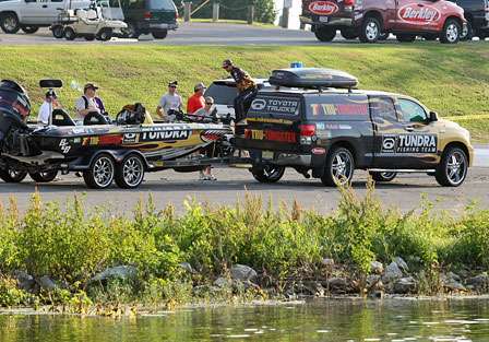 Mike Iaconelli climbs aboard his boat before being backed down the boat ramp at Kentucky Dam Marina.