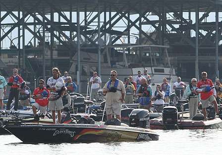 Elite Series pros and their co-anglers stand for the national anthem.