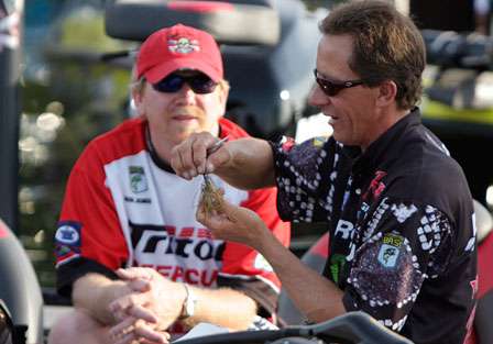 Charlie Hartley gives a lesson on jigs as his co-angler Rob Jones looks on.