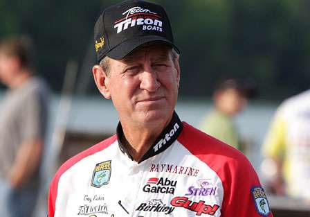 Guy Eaker, the senior of this Bassmaster Elite Series field, talks to other anglers on the dock just prior to take-off on Day One.