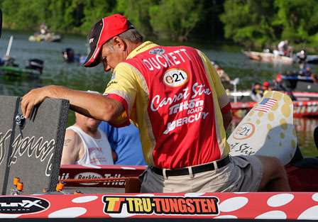 Boyd Duckett packs away tackle boxes as he is backed into Kentucky Lake at the Kentucky Dam Marina, site of the launch and weigh-in of the Bluegrass Brawl.