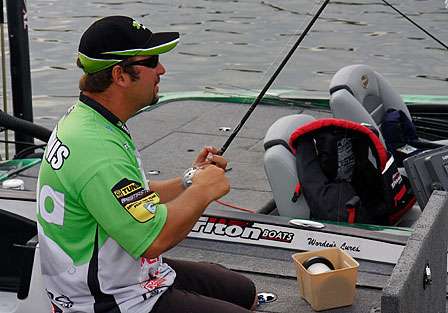 Fred Roumbanis cranks new line onto one of the reels he will use to battle with Kentucky Lake bass on Day Two of the Bluegrass Brawl presented by DieHard Platinum Marine Batteries.