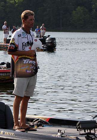 Kevin Worth, a local favorite on Kentucky Lake, honors Old Glory as the national anthem rings throughout the marina.