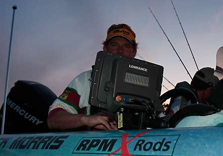 Rick Morris peers over his Lowrance electronics as he waits in line to launch into Old Hickory on Day Two of the Tennessee Triumph.